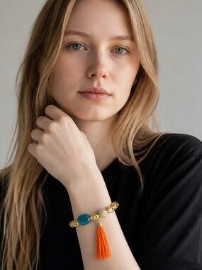 Gold Bead Bracelet with Teal Stone and Orange Tassel